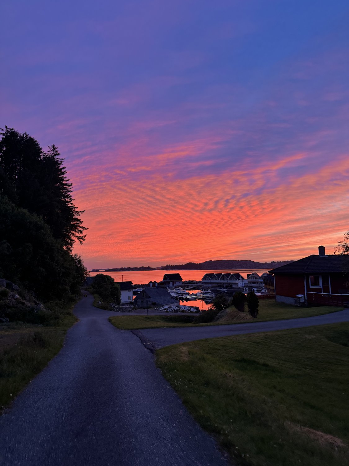 The village under a blazing dusk sky